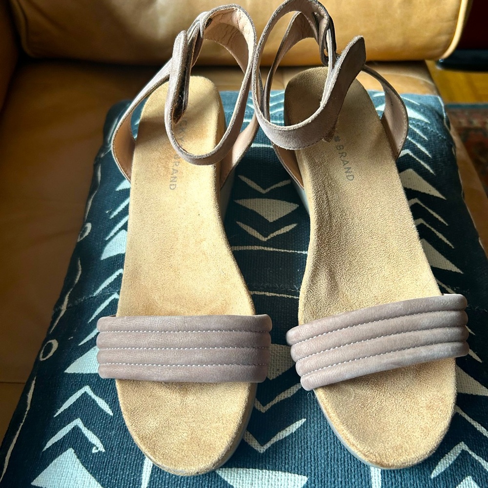 NWOB. Taupe Lucky Brand low wedge sandals with Velcro ankle strap. Size. 8